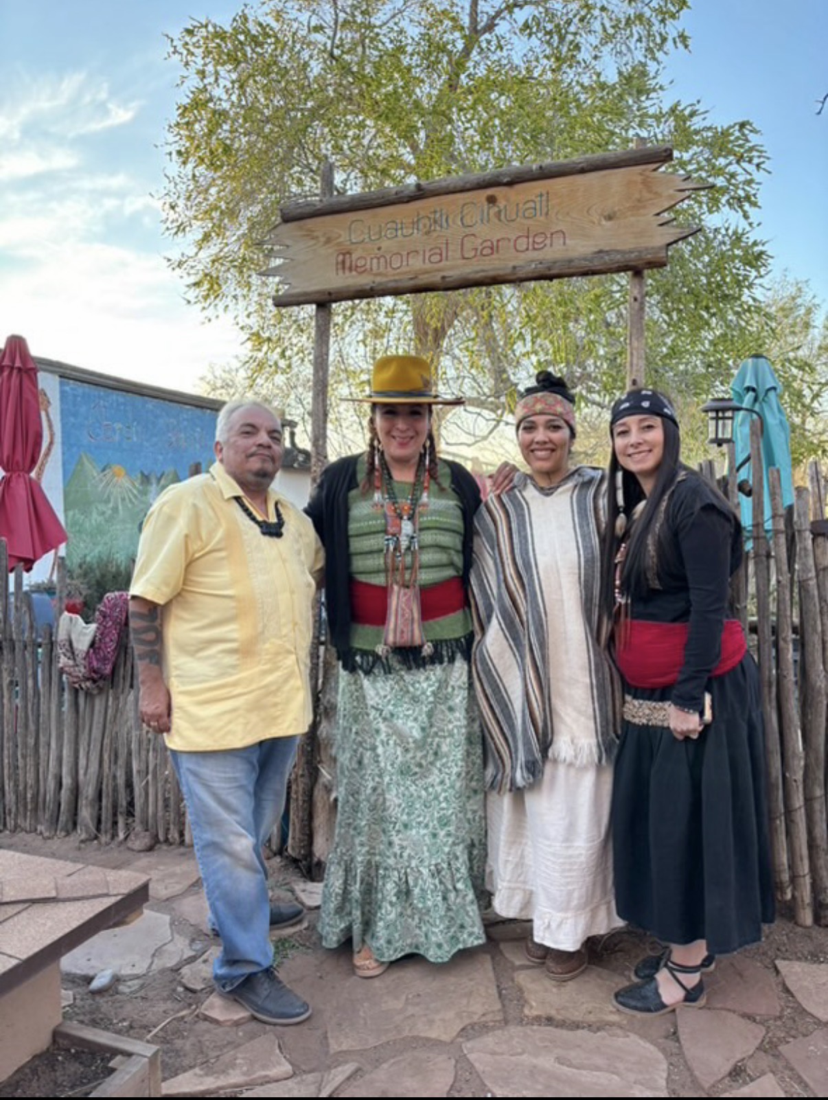 Ryanne standing with maestro D'santi, maestra Diana, and maestra Rosa at the Cuahtli Cihuatl Memorial Garden